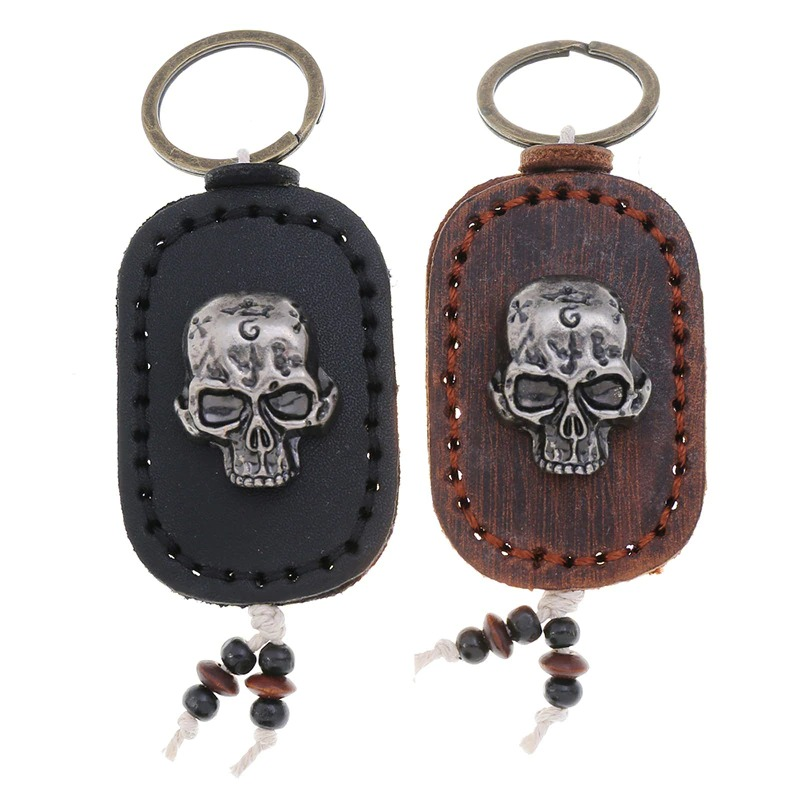 Punk genuine leather keychains featuring skull pendants in black and brown, perfect fashion accessory for men and women.