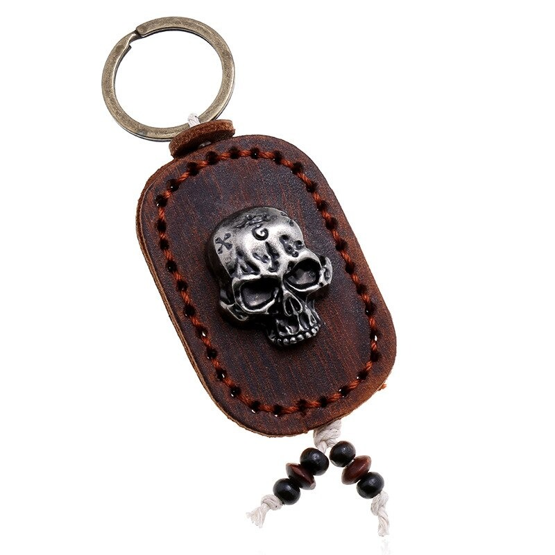 Punk genuine leather keychain with skull pendant, stylish accessory for bags and car keys.