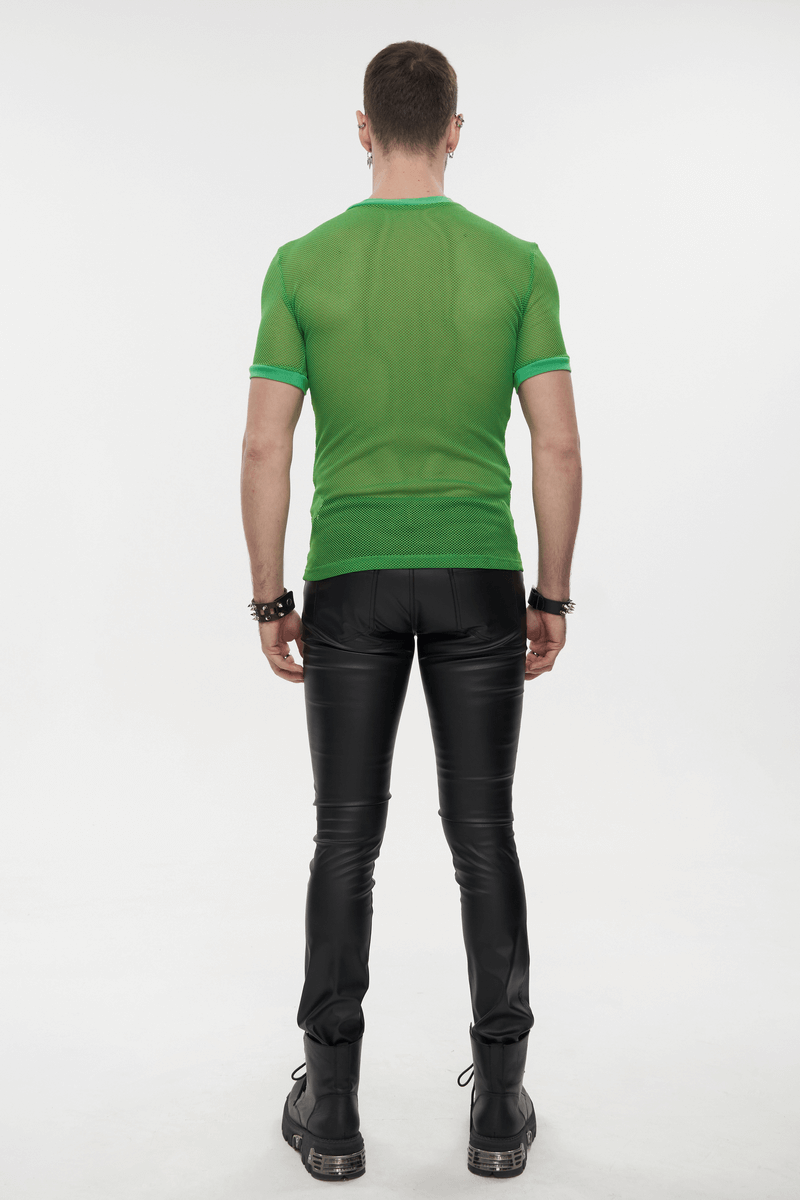 Back view of a man wearing a bright green short-sleeved mesh T-shirt with black pants, showcasing alternative fashion style.