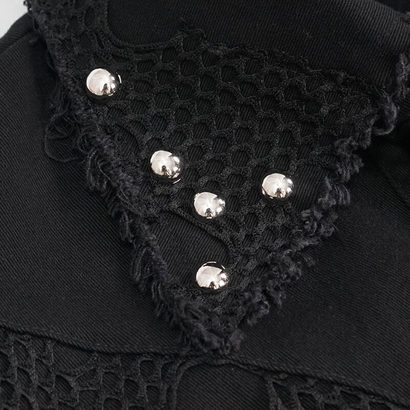 Close-up of a black punk vest featuring silver buttons and mesh detailing for a trendy alternative look.