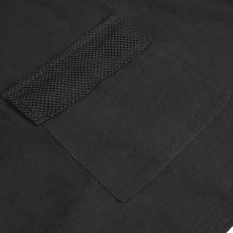 Close-up of a stylish black hoodie pocket featuring a textured mesh insert, perfect for punk fashion.