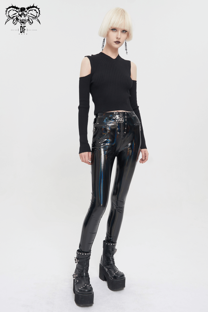 Punk style women's black off-shoulder knitted top paired with shiny black vinyl leggings and statement platform boots.