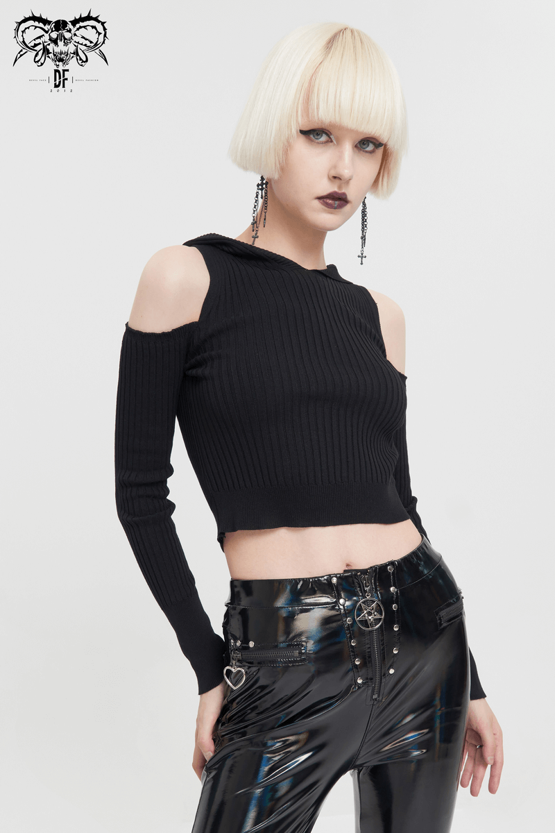 Model wearing a punk-style black off-shoulder knitted hooded top with long sleeves and shiny black pants.