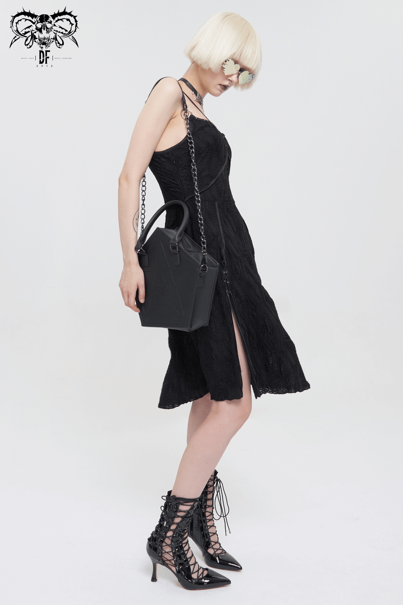 Model wearing a black lace dress, holding a punk pentagon crossbody bag with chain handle, showcasing gothic style.