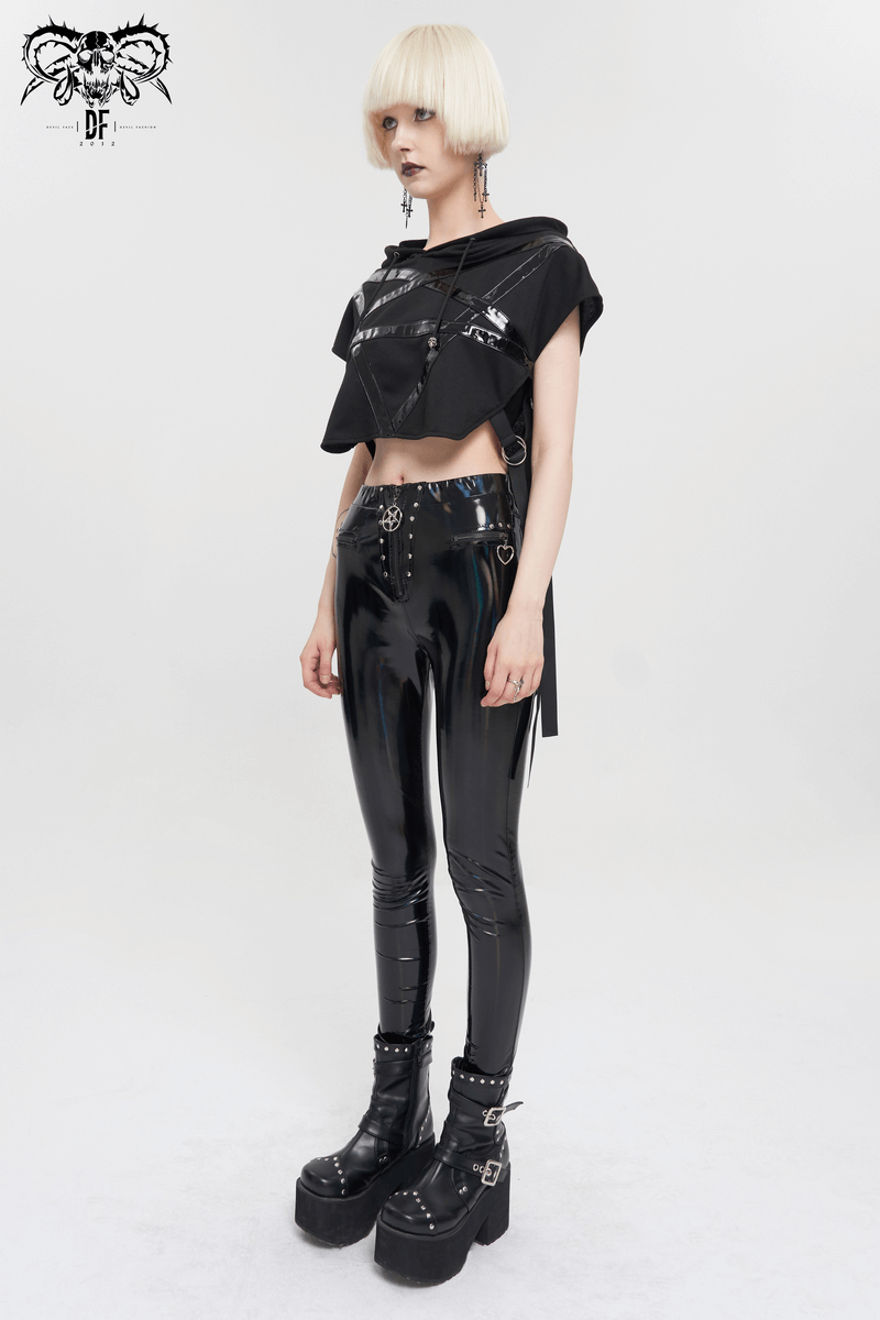 Gothic punk fashion model wearing a black pentagram hooded short top and shiny black leggings with chunky platform boots.