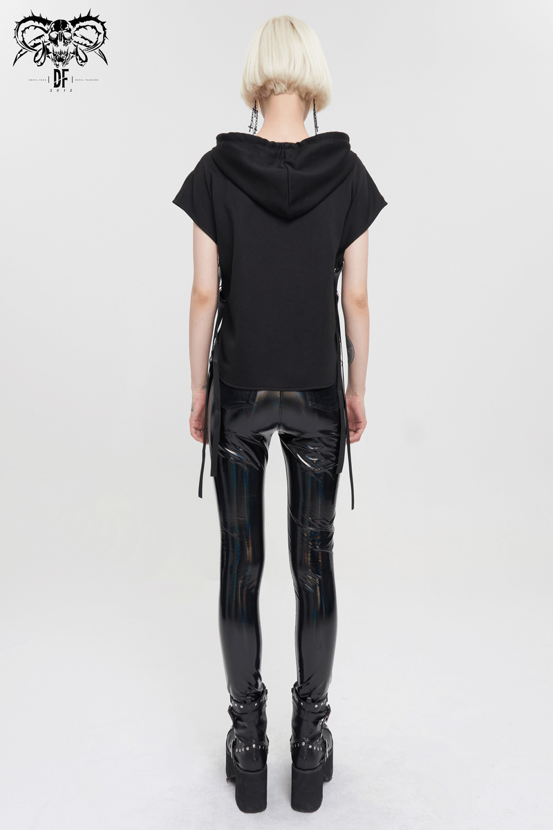 Back view of a model in a black punk pentagram hooded top and shiny fitted leggings.
