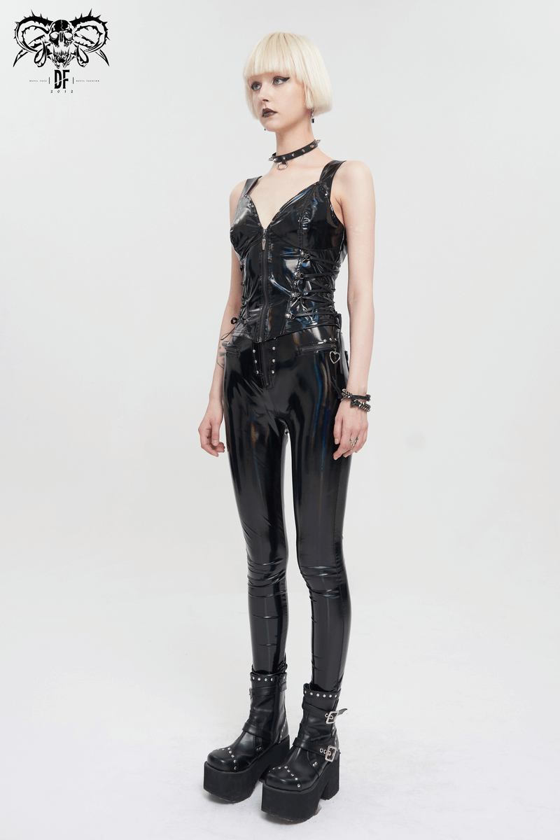 Stylish punk woman in shiny black PU leather waistcoat and pants, showcasing goth fashion with edgy footwear.