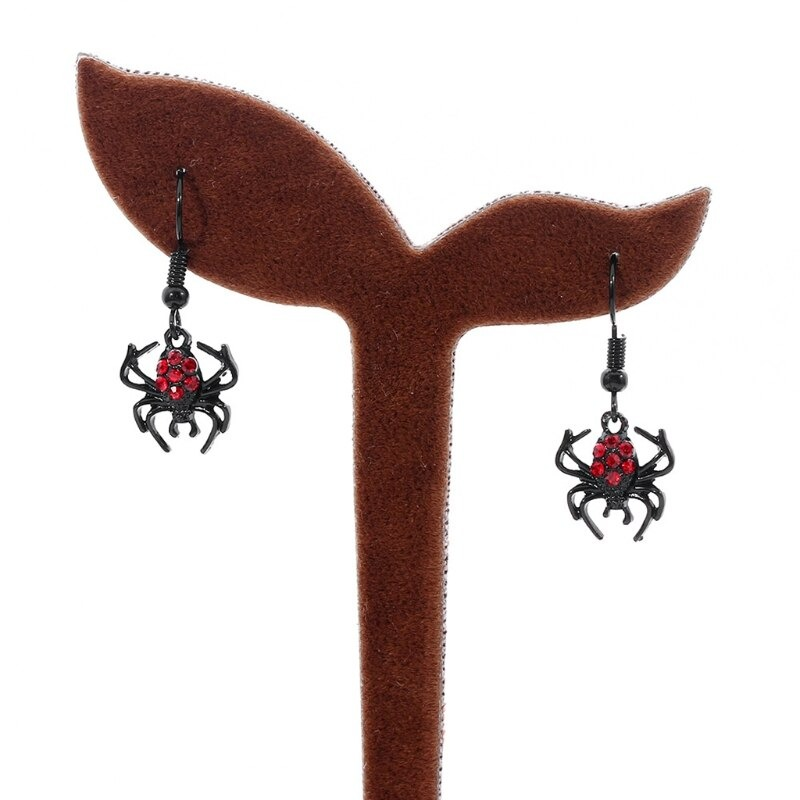 Punk red rhinestone spider earrings displayed on a stylish jewelry holder, perfect for gothic fashion enthusiasts.