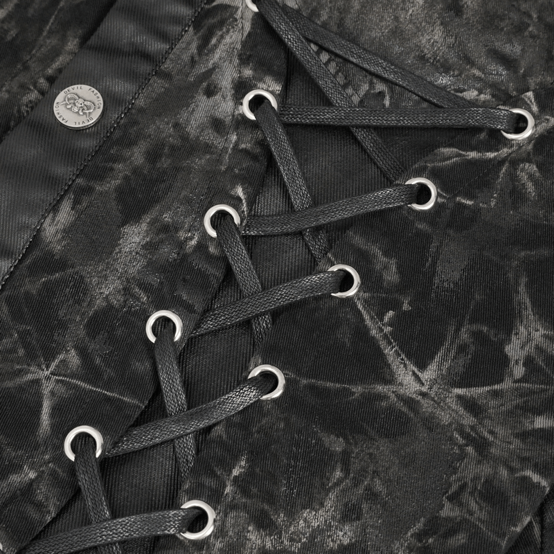 Close-up of black punk rock waistcoat fabric with gothic lace-up detail and rivets.
