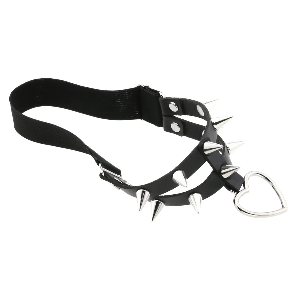 Black punk rock leg garter with silver spikes and heart pendant, perfect for goth fashion and bold accessories.