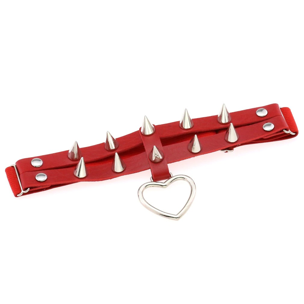 Punk rock red leg garter belt with silver spikes and heart pendant, stylish women's goth accessory.