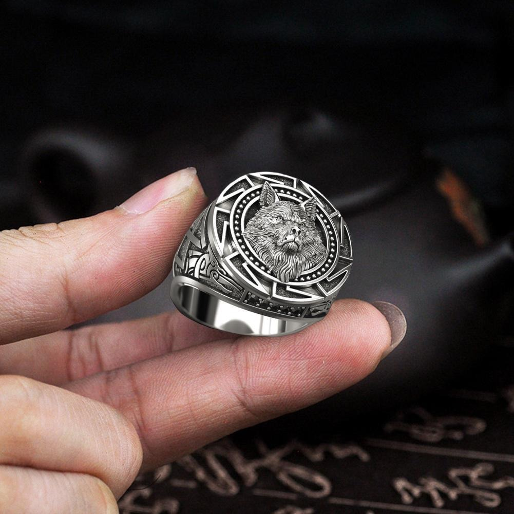 Punk rock style wolf head men's ring showcased in hand, featuring intricate Celtic design and copper details.