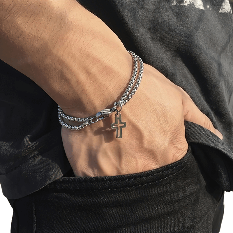 Punk rock titanium steel double chain bracelet with cross pendant worn on a man's wrist, perfect biker style accessory.