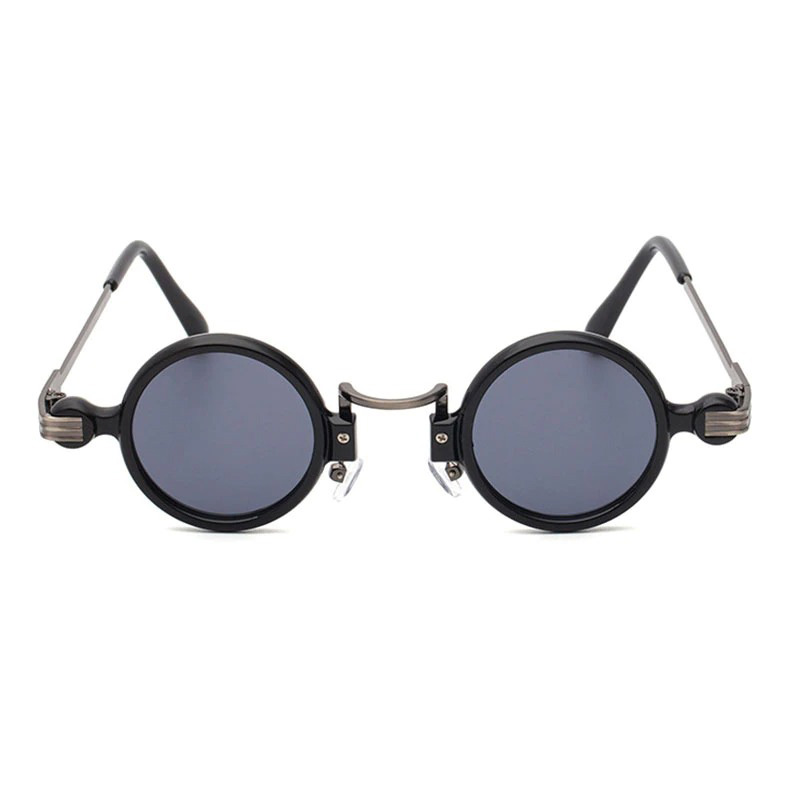 Punk round sunglasses for men and women with dark lenses and stylish black frame, perfect for a vintage fashion statement.