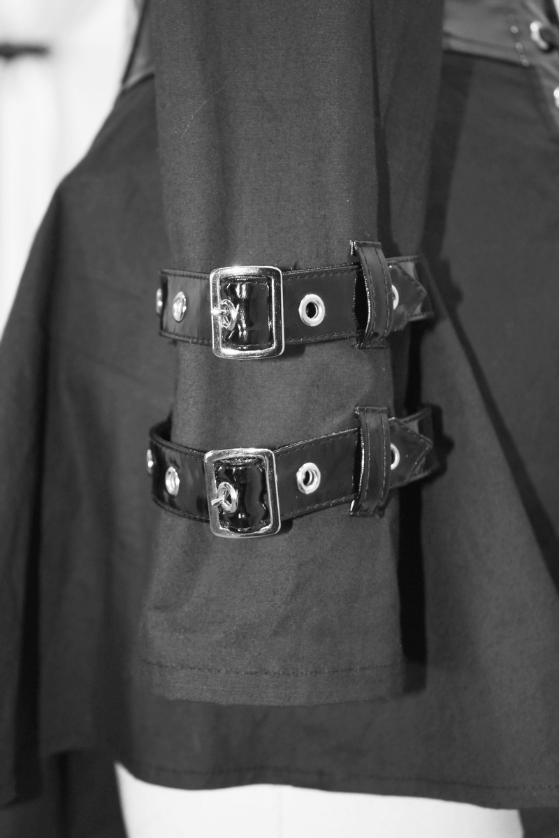 Detail of edgy black women's long sleeve punk shirt showcasing stylish PU leather buckle accents.