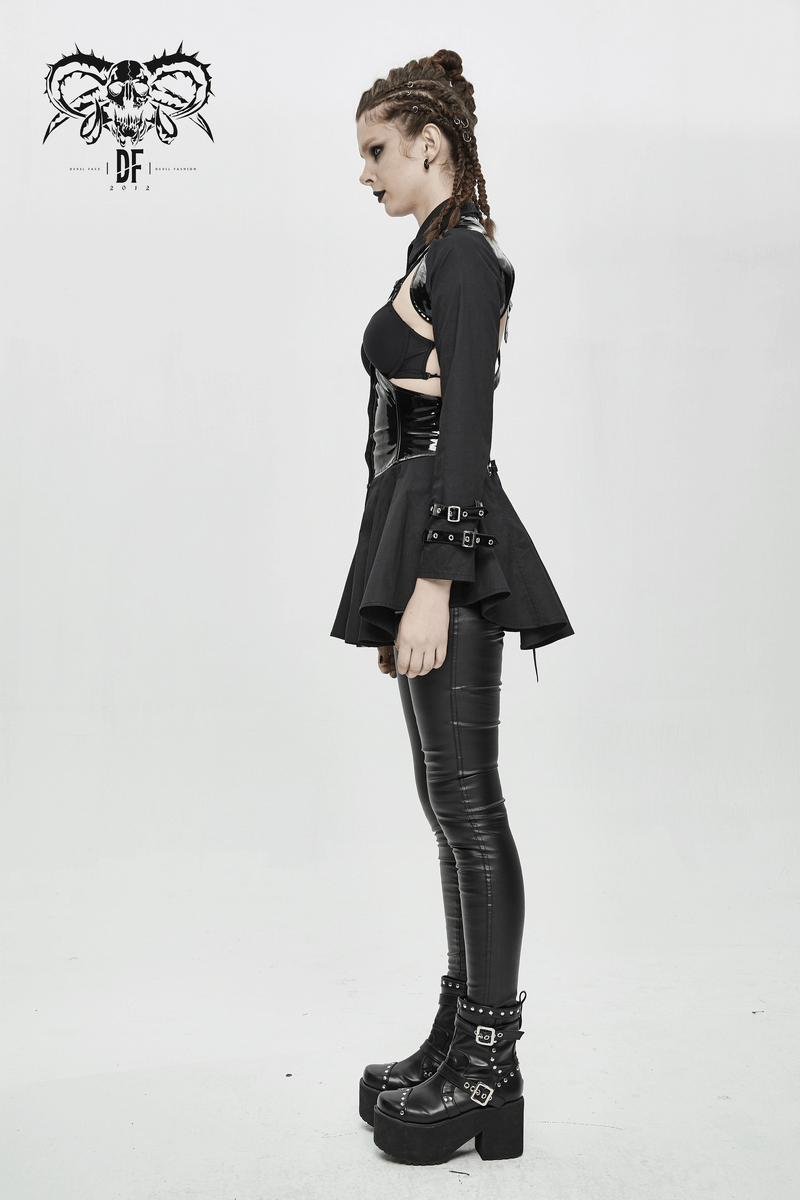 Woman in punk sexy long sleeve shirt with lace-up back and black leather pants, showcasing edgy gothic fashion.