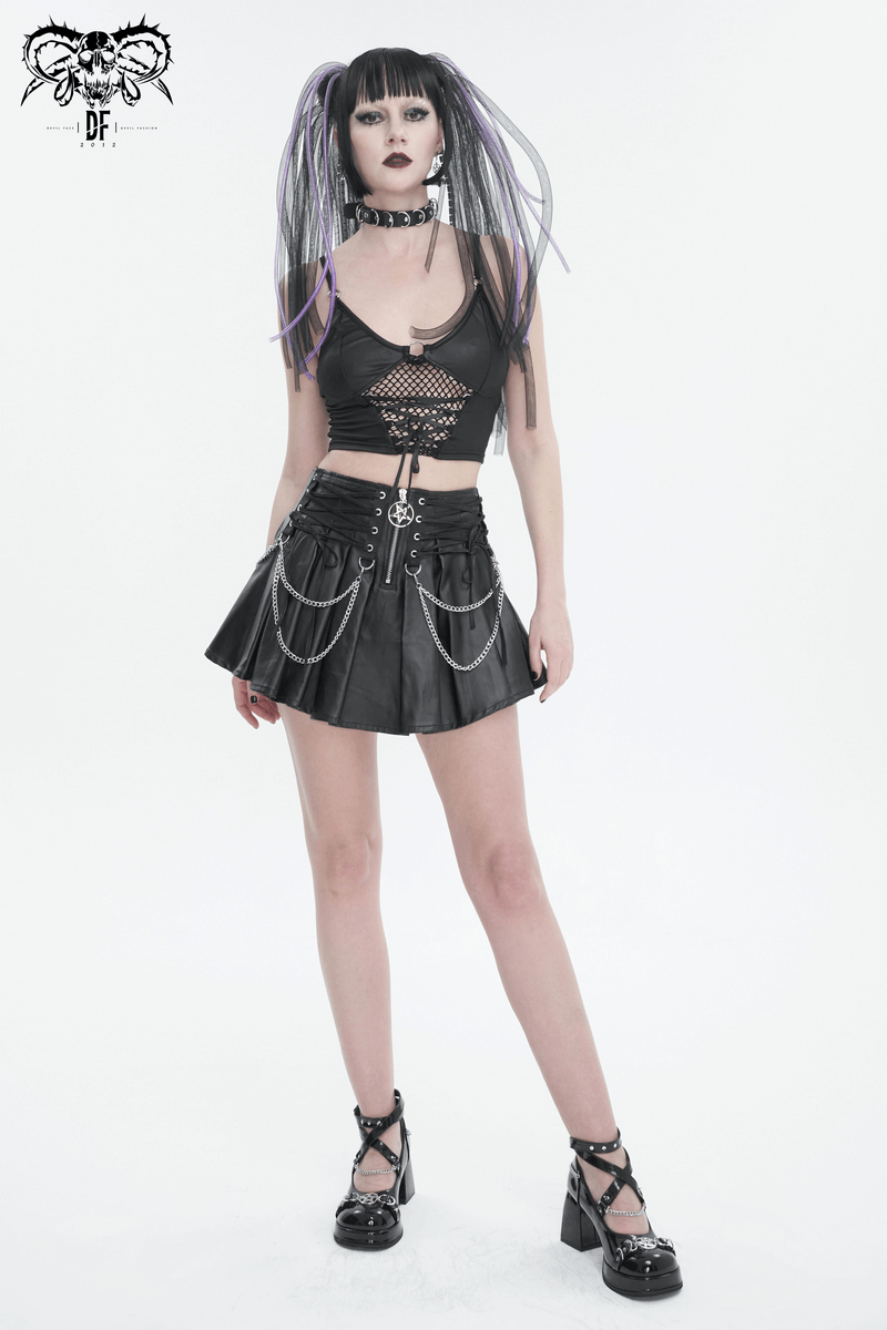 Model in a punk-inspired black pleated skirt with chains and lace-ups, showcasing edgy style and attitude.