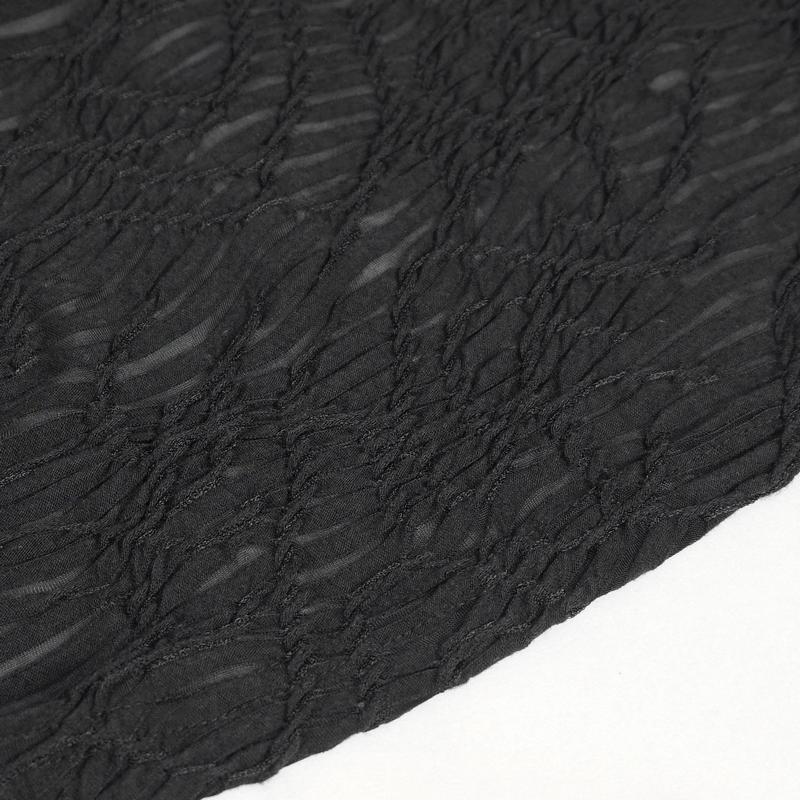 Close-up of textured black fabric showcasing wrinkled details for punk apparel design.