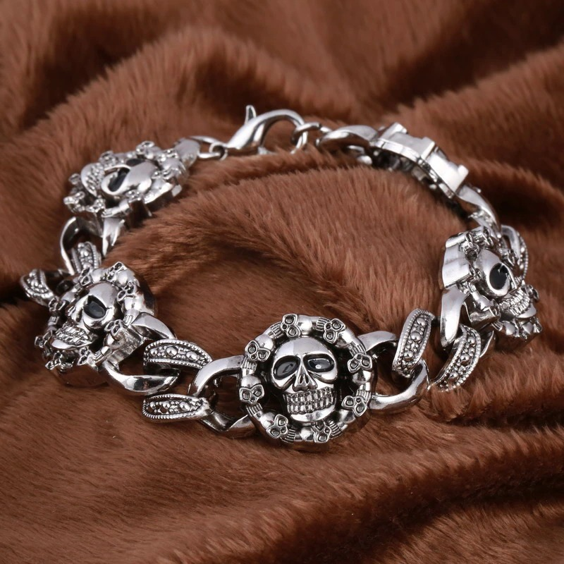 Punk stainless steel bracelet for men with double skull heads, perfect gothic fashion accessory.