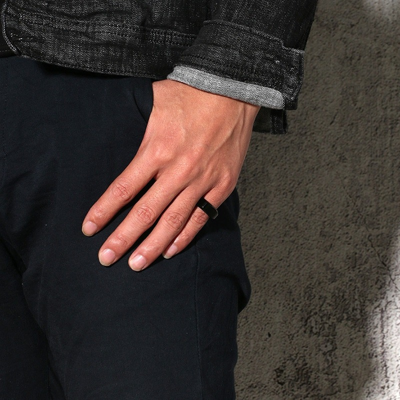 Stylish unisex punk stainless steel ring on a hand, perfect for weddings or fashion statements.