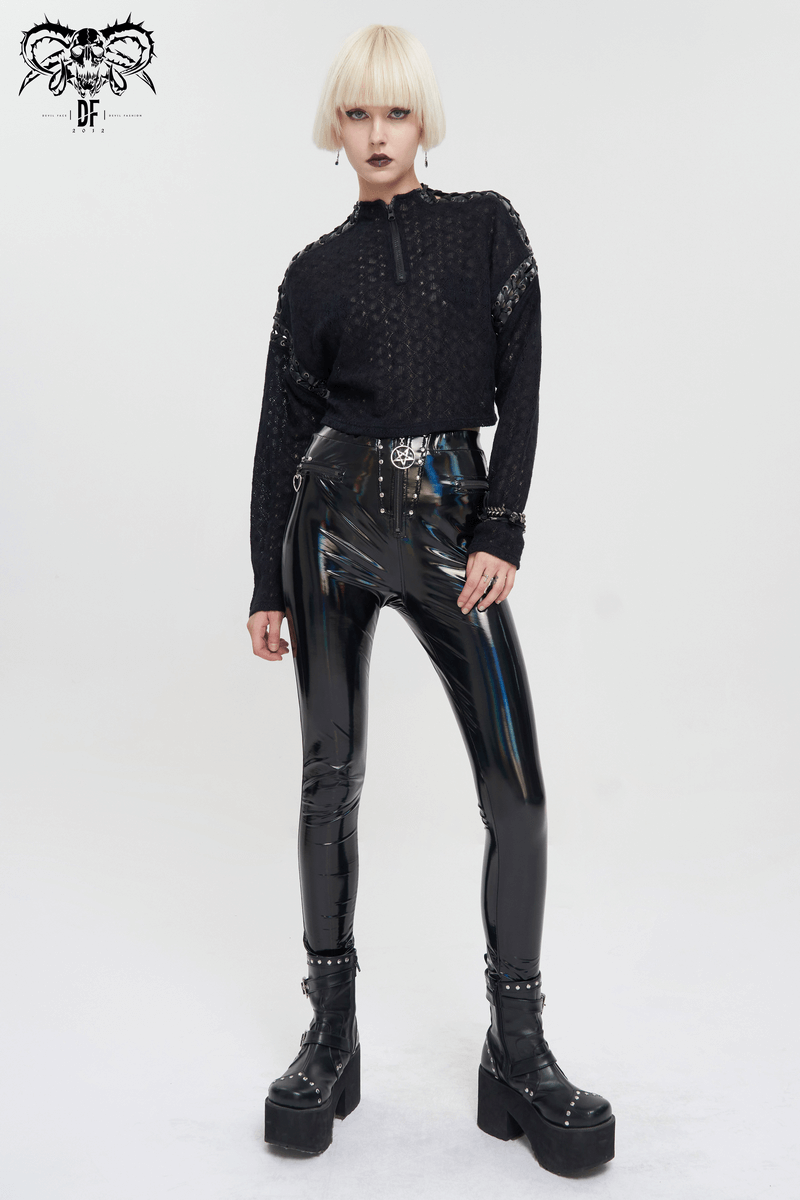 Model showcasing a black punk long sleeve top with stylish black shiny leggings in an alternative fashion look.