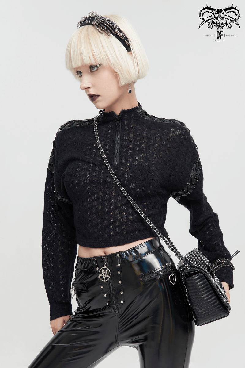 Gothic women's black long sleeve crop top with punk stitching and stylish zipper detail, paired with shiny pants.