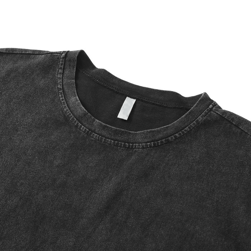 Close-up of a casual punk style men's tank top in black with a stylish round neckline and distressed fabric texture.