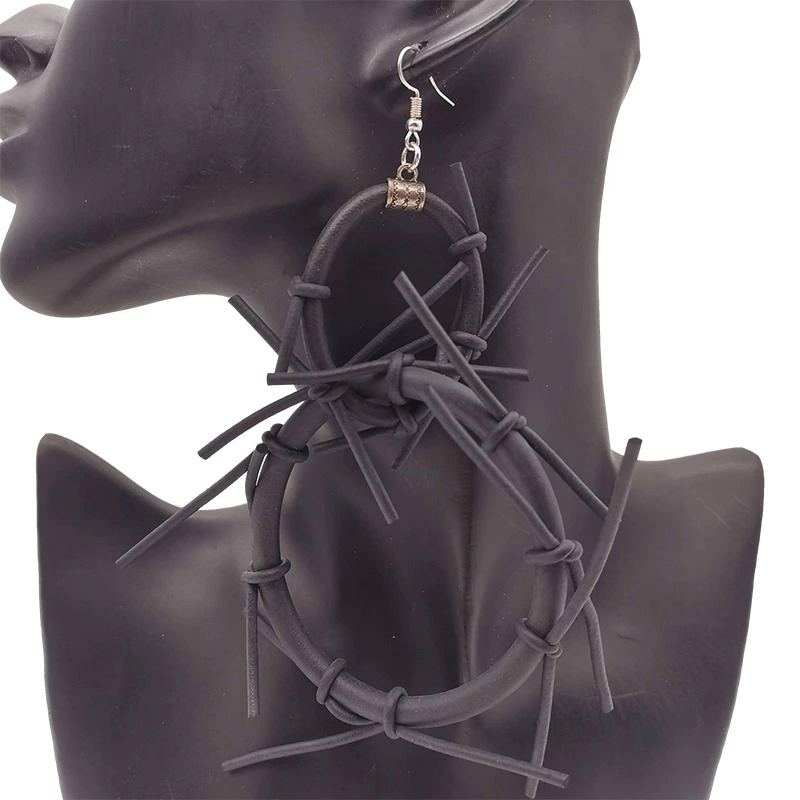 Handmade punk style big black rubber earrings with unique design, perfect for gothic fashion lovers.