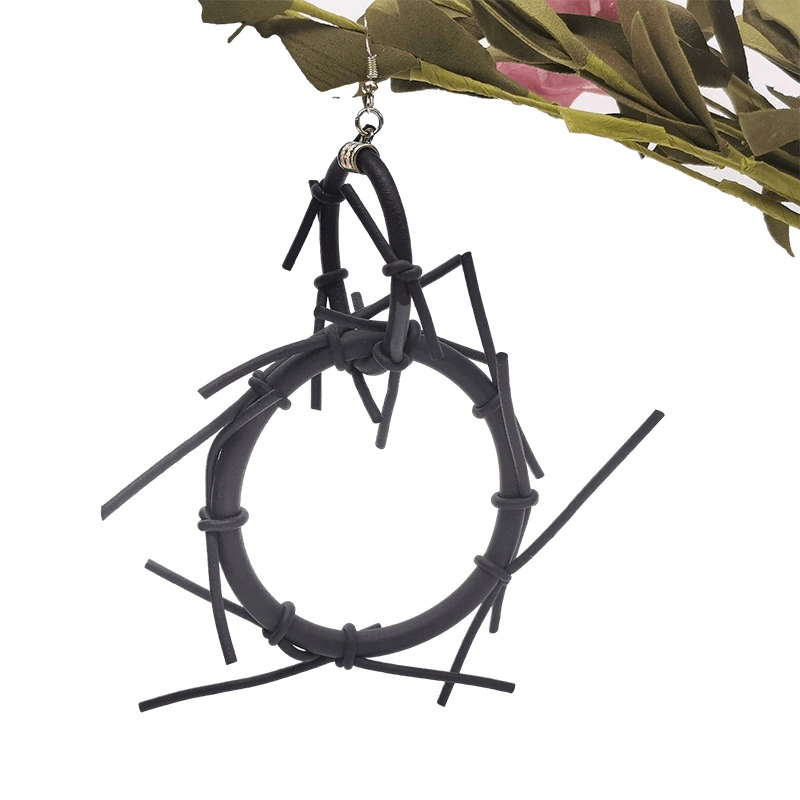 Handmade punk style big earrings in black rubber, featuring a unique design and a bold gothic vibe.