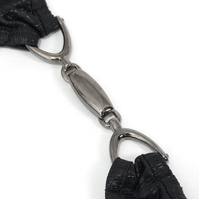 Close-up of the black metal clasp on punk style low waist bikini bottom, highlighting its quality design and durability.