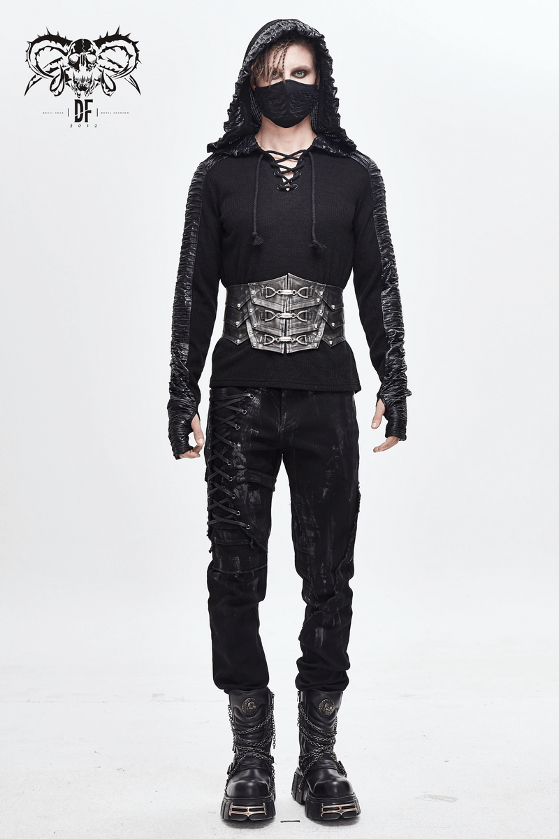 Punk-style male model in black hoodie showcasing vintage corset belt and stylish black pants.