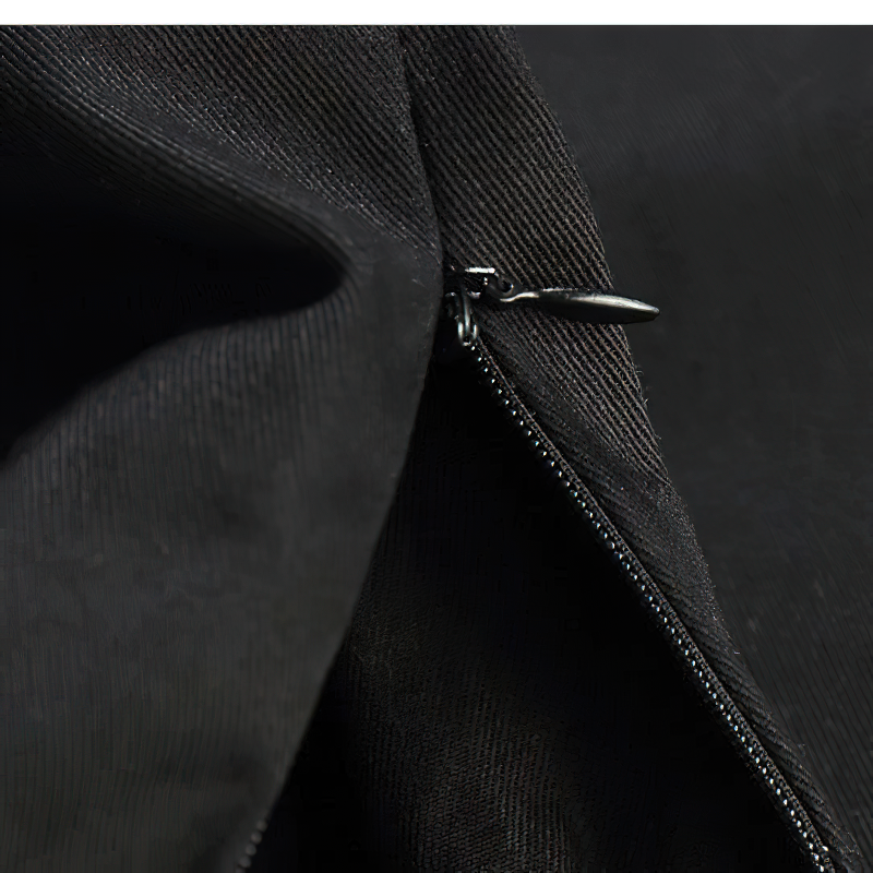 Close-up of black zipper detail on punk style cargo pants, showcasing quality craftsmanship and stylish design.