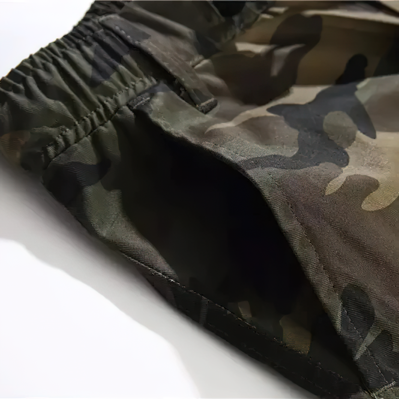 Close-up of punk style camouflage cargo pants showcasing elastic waistband and pocket details.