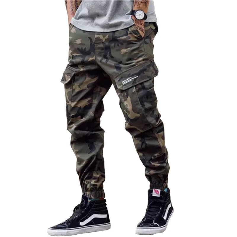 Men's punk style cargo pants in camouflage with pockets, perfect for a rebellious streetwear look.