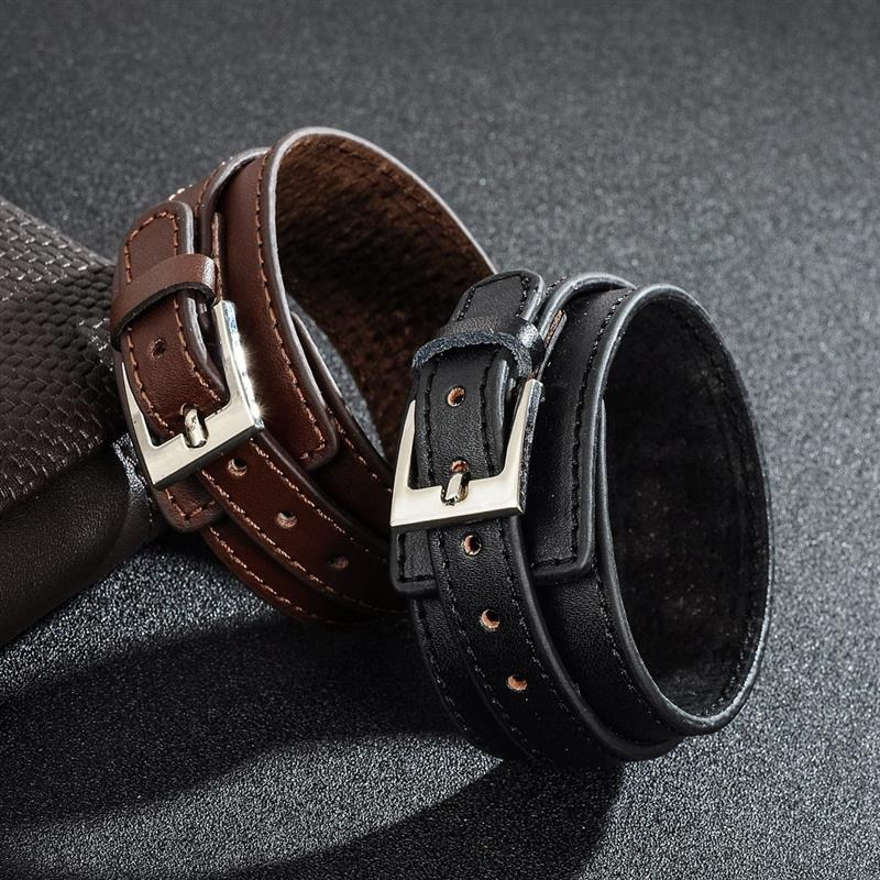 Punk style genuine leather wristbands in black and brown with stainless steel buckles on a dark surface.