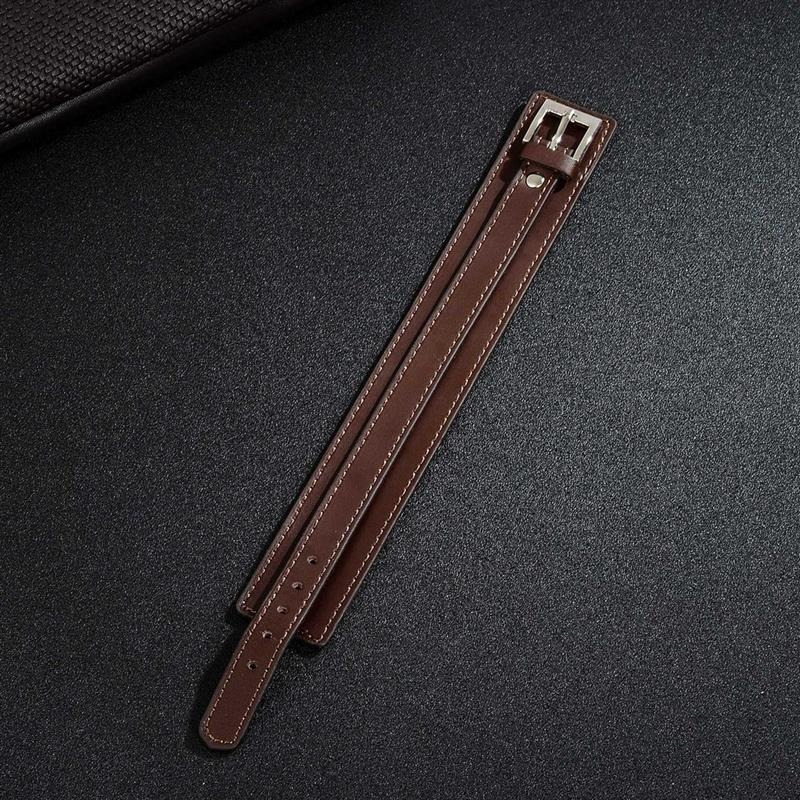 Brown genuine leather wristband with stainless steel buckle, vintage punk style, adjustable cuff bracelet accessory.