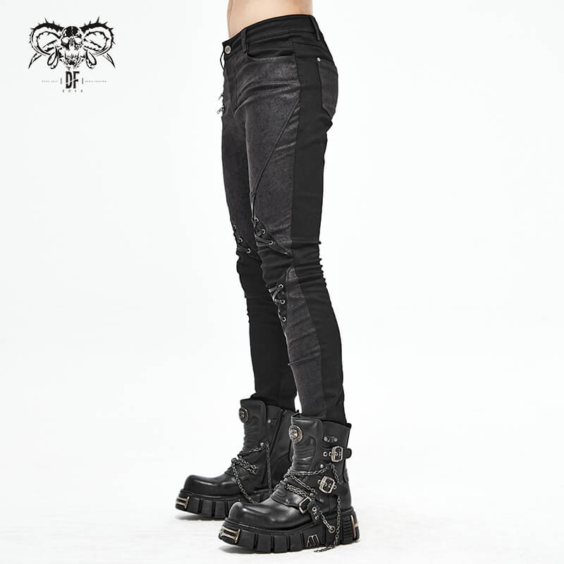 Punk style men's black jeans with lace-up detail, paired with chunky black boots, showcasing a fitted cut and faux leather trim.