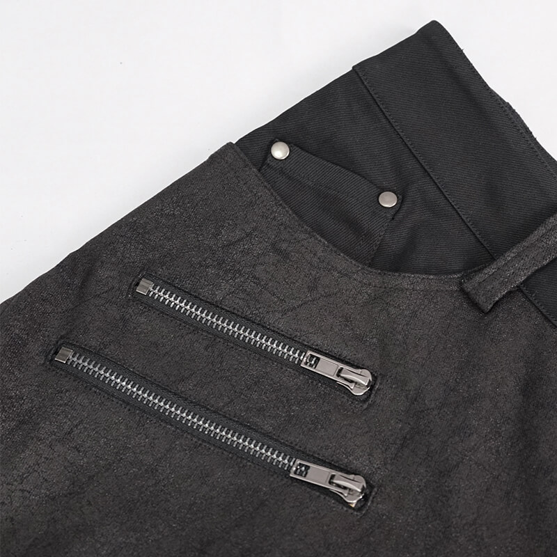 Close-up of punk style men's jeans featuring faux leather trim and stylish zippers, perfect for edgy fashion.