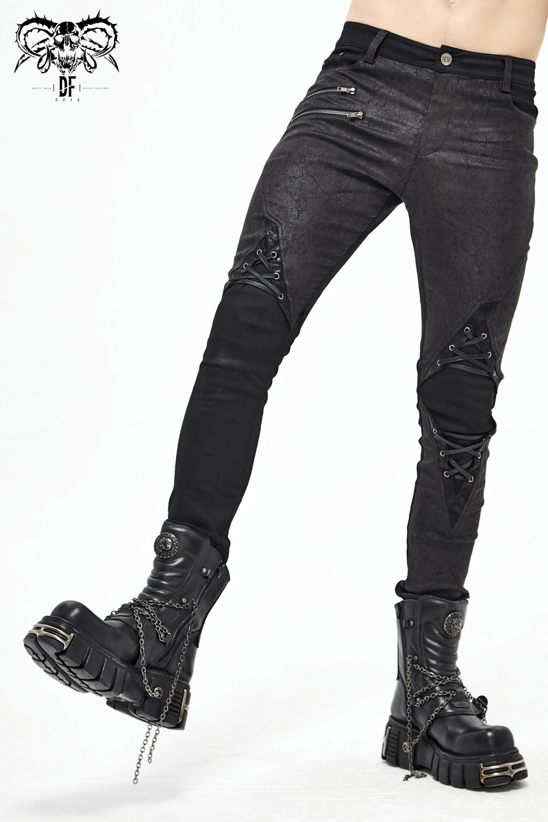 Punk style men's black jeans with lace-up details and faux leather trim, paired with edgy black combat boots.
