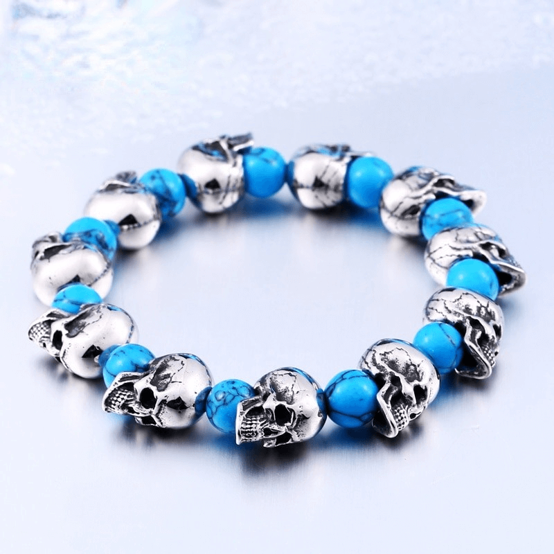 Elastic unisex wristband with punk skull head beads and blue accents, perfect stylish accessory for fashion lovers.