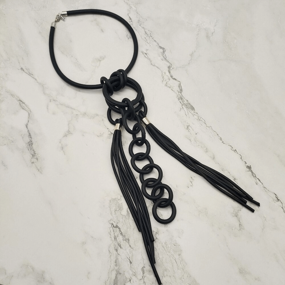 Handmade punk style black rubber necklace with unique loops and tassels for women, adding edgy flair to any outfit.