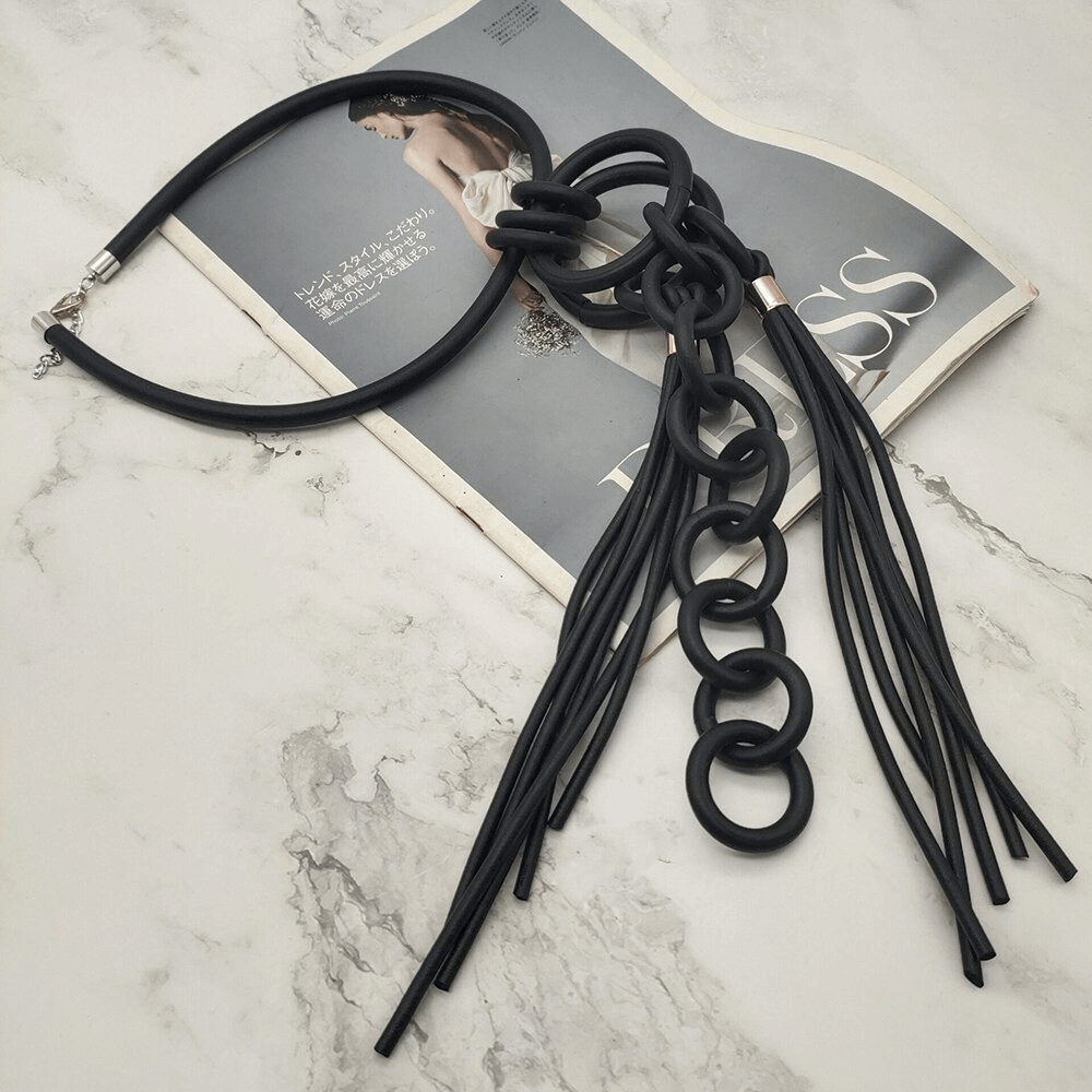 Handmade punk style black rubber necklace for women with long tassels and statement design.