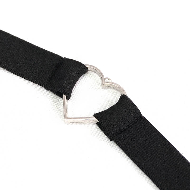 Black elastic strap with heart-shaped metal buckle, stylish accessory for punk or alternative fashion.