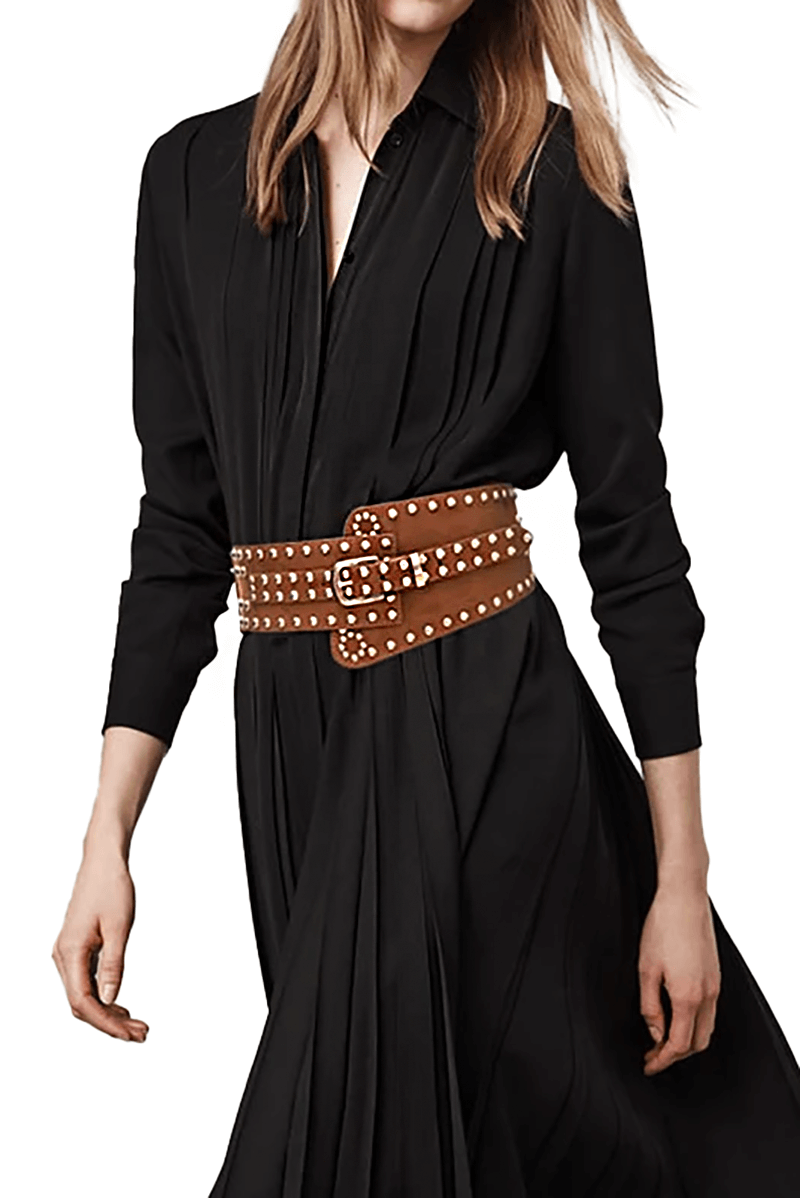 Punk style women's wide irregular buckle belt in brown with rivets, paired with a sleek black dress.