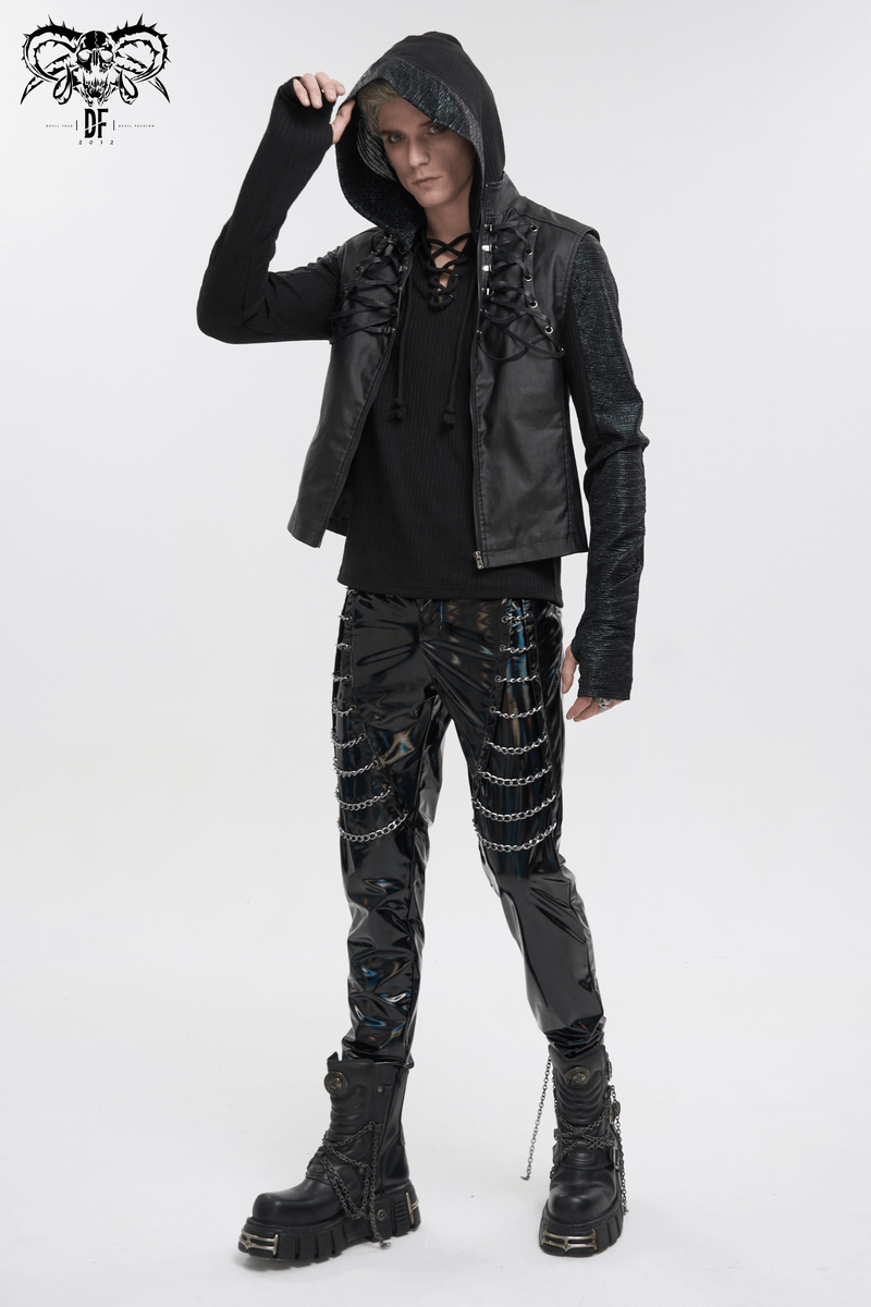 Gothic punk man in stylish black leather vest and chained pants, showcasing edgy fashion with a bold attitude.