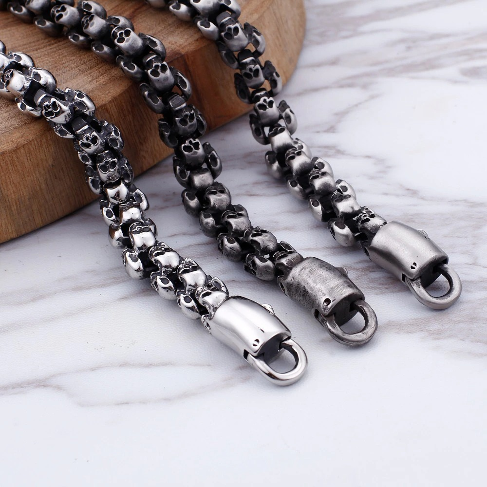Stylish punk skull bracelet made of stainless steel, featuring unique skull designs and sturdy clasps.