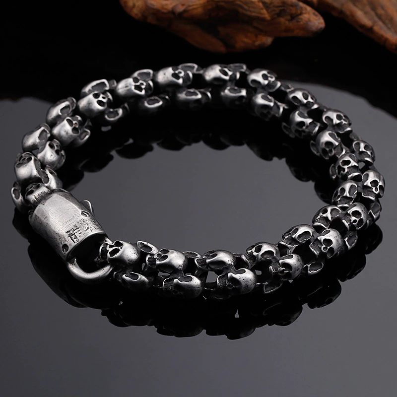 Punk style stainless steel skull bracelet for men, featuring a unique skull design perfect for enhancing any edgy outfit.