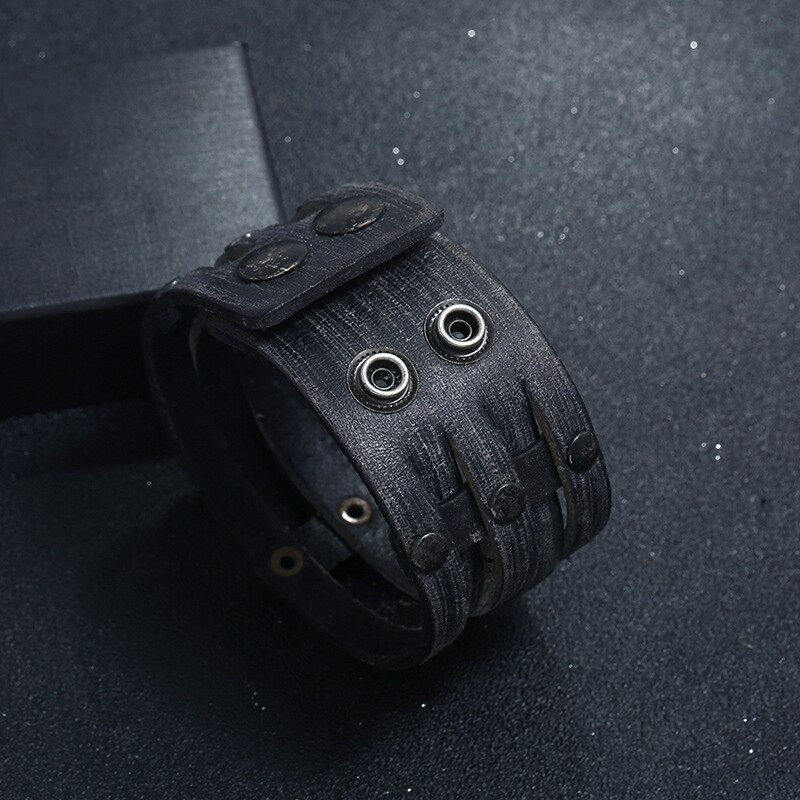 Punk wide leather bracelet with rivets, unisex fashion accessory for men and women, stylish black design.