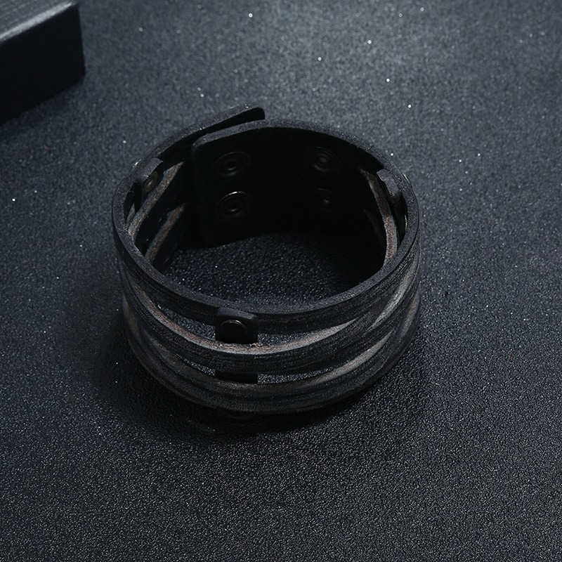 Punk wide leather bracelet with rivets, unisex fashion jewelry for men and women, stylish black accessory.