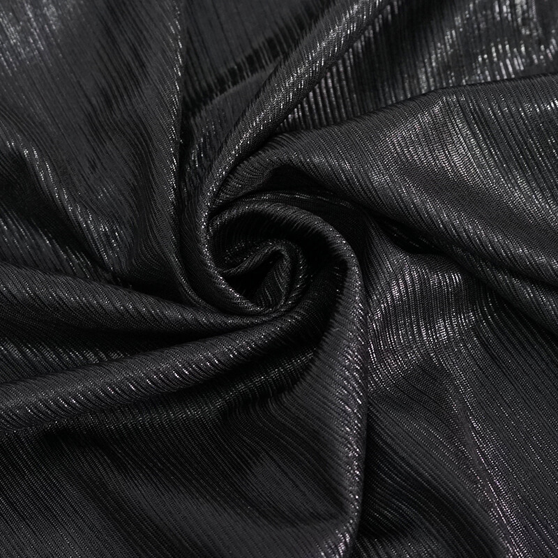 Black textured fabric showcasing a stylish punk aesthetic, perfect for trendy women's tops.